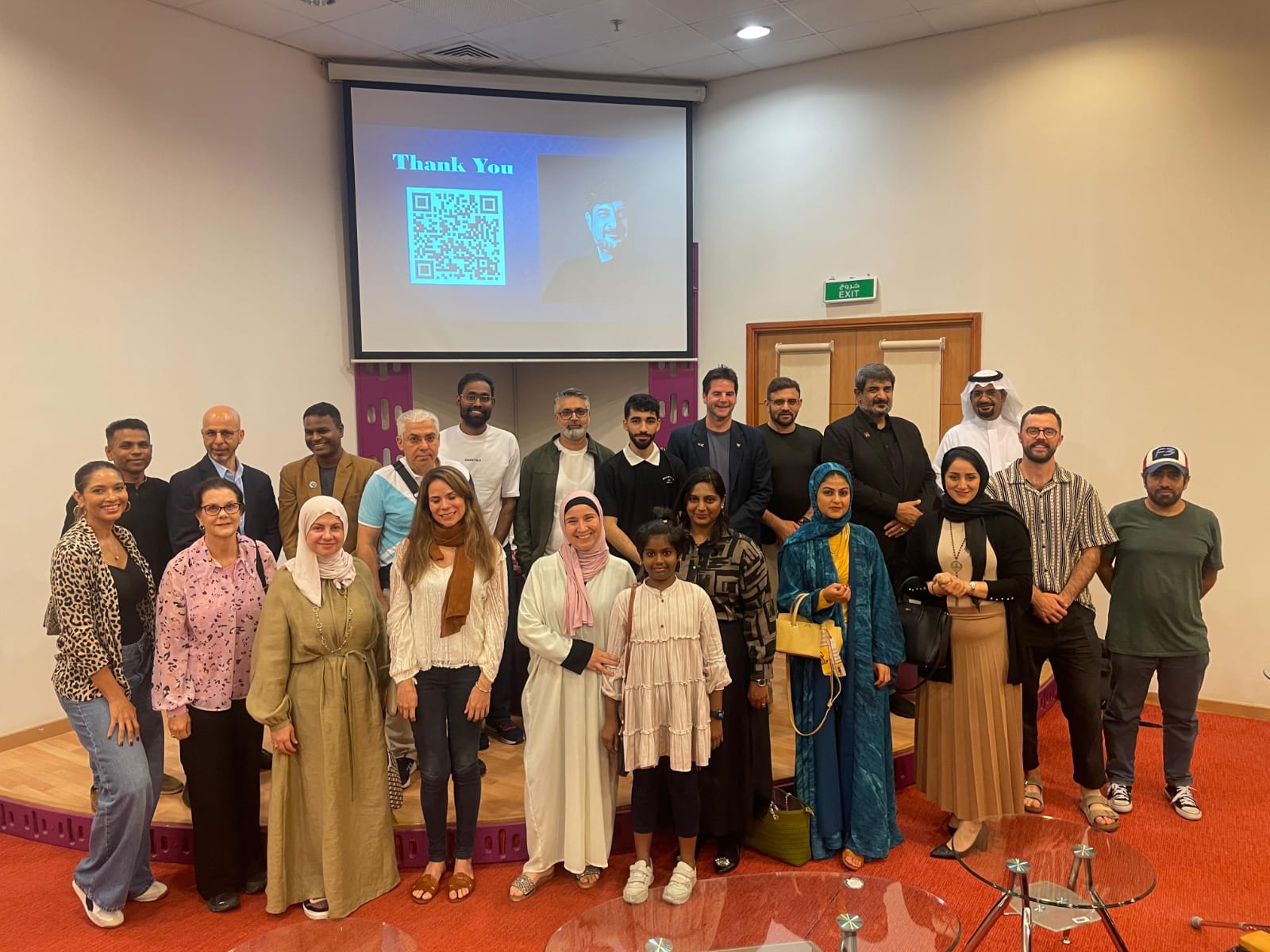 Group of students and faculty posed for a photo at an event