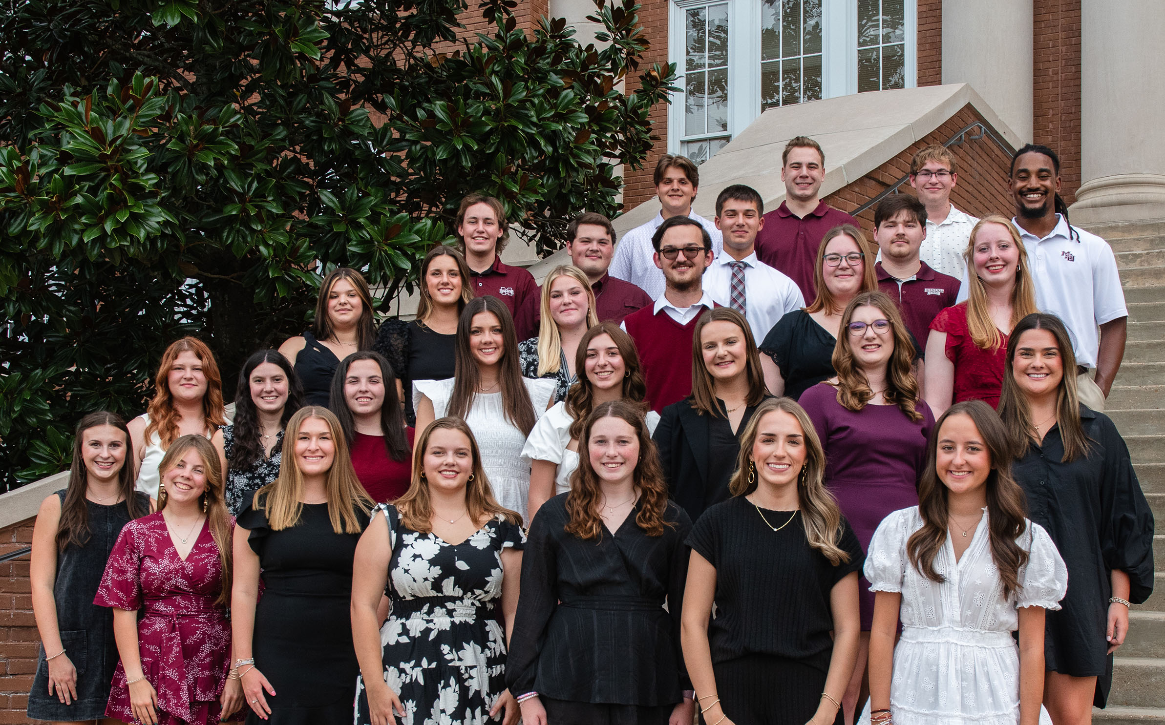 METP cohort posed for a photo on stairs