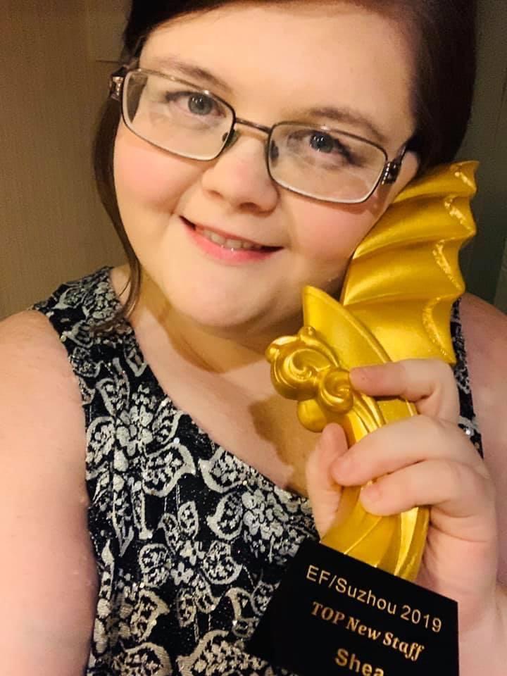 Shea Thrash with award.
