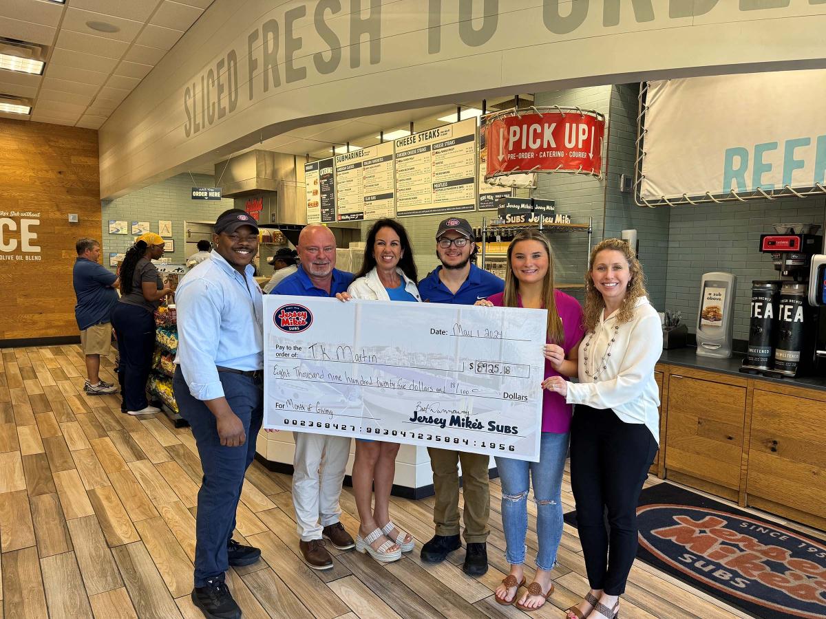 Representatives from Starkville's Jersey Mike's Subs and MSU's T.K. Martin Center pose for a photo